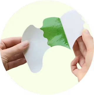 Protective film being peeled from a Wellnee patch